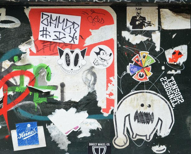 A number of stickers, or slaps, on a black metal box