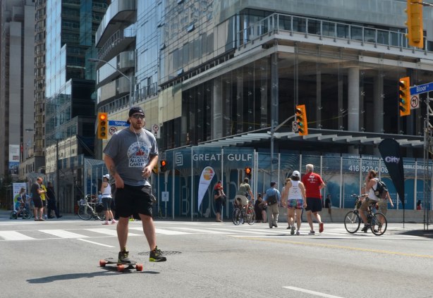 A man is skateboarding on the street