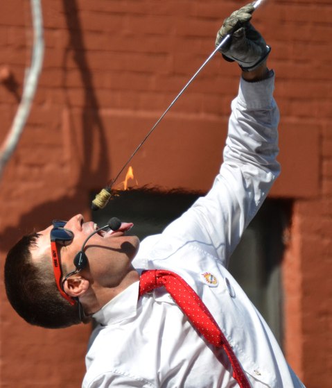 Part of Fireguy's Oh Yeah show where he puts a flaming rod into his mouth. 