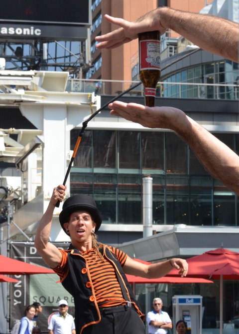 Part of the Funnykito Show where he tries to remove a beer bottle from the hands of a volunteer using a whip 