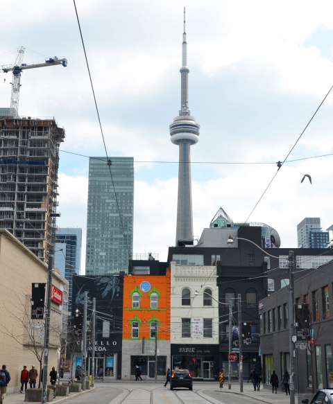 Looking towards shops on Queen Street West with the CN Tower behind. 