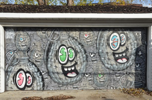 Garage door covered with spud bombs street art