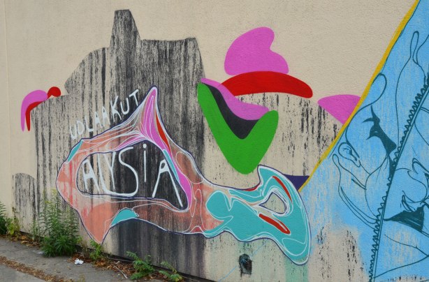 A street art painting with the words udlaakut Alysia. Udlaakut is Inuit for good morning