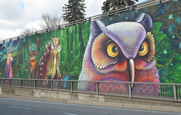 a large owl in a mural