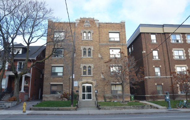 Two four storey apartment complexes and a single family home on Vaughan Road. 