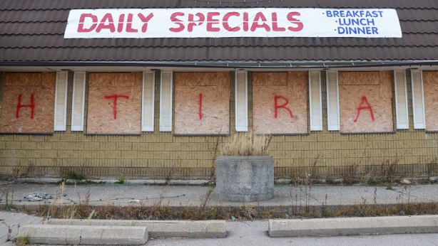 daily specials banner on the roof of an abandoned restaurant near Hamilton