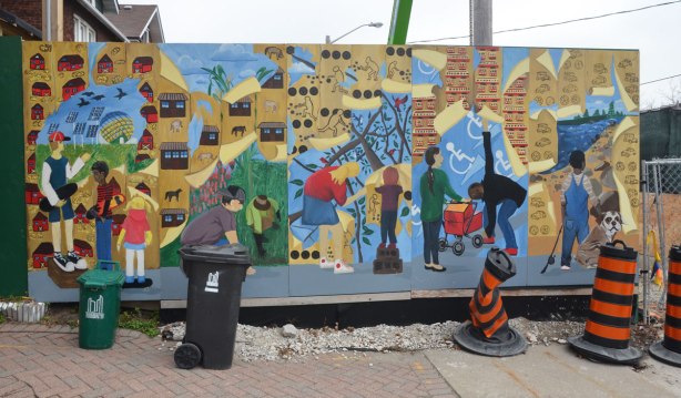 A mural of kids peeling away layers of wallpaper with pictures on it. 