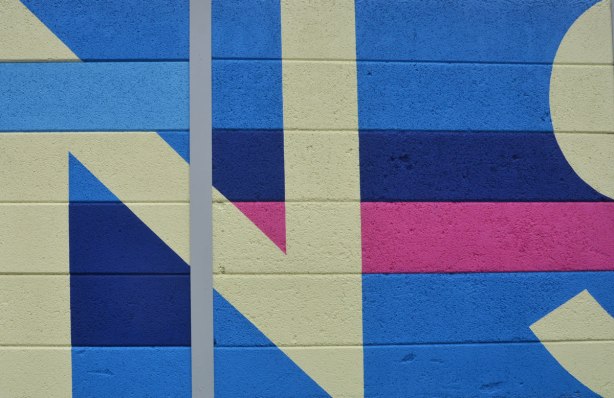 close up of the letter N and part of S in the Transitions mural on a TTC fence on Coxwell ave. 