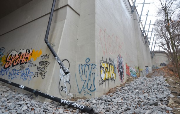 graffiti on concrete bridge supports