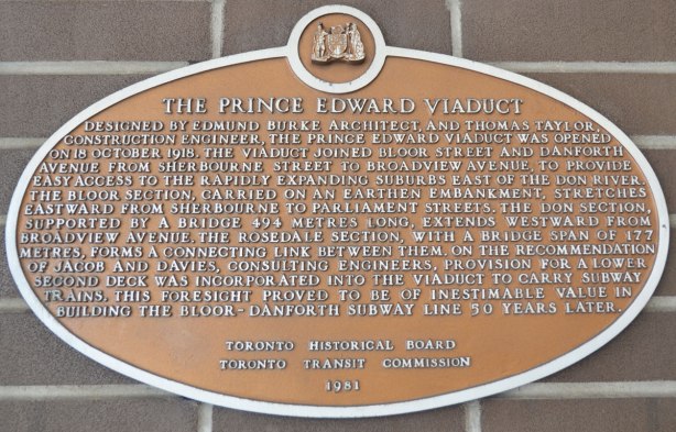 Toronto Historical commission sign about the history of the Prince Edward Viaduct, a bronze plaque posted on the brick wall, interior, of Castle Frank subway station. 