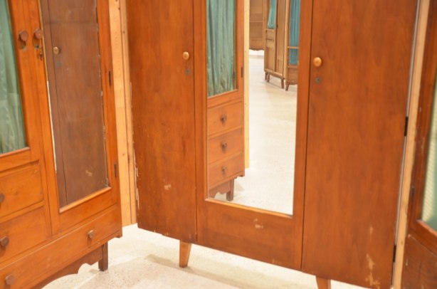 part of an art installation by Chinese artist Song Dong using vintage wooden wardrobe doors with mirrors and curtains, reflections