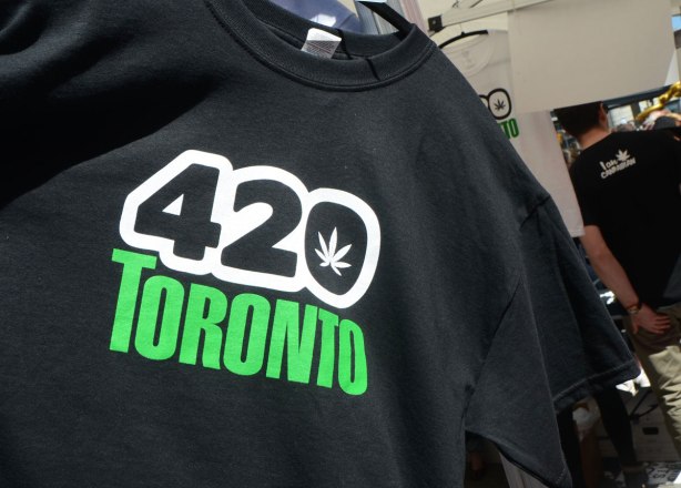 Part of 420 day celebrations at Dundas Square - a black Tshirt for sale. It has 420 Toronto on it, with a cannabis leaf in the middle of the zero 