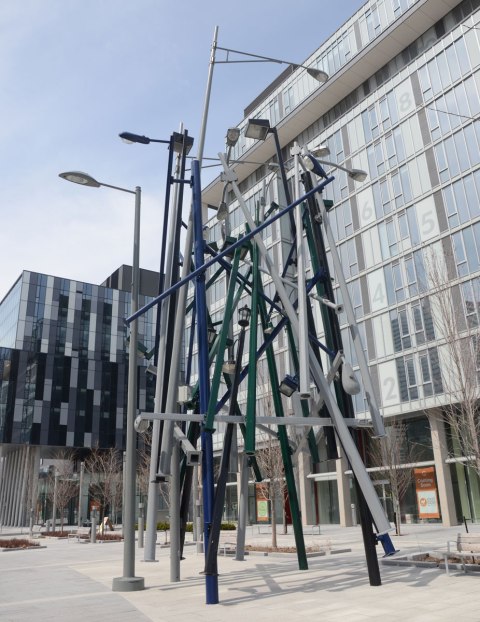 A tall art installation as public art on Front Street in the Canary District, Lampposts by Tadashi Kawabata, construction from many different styles of street lamp posts all arranged in a cluster