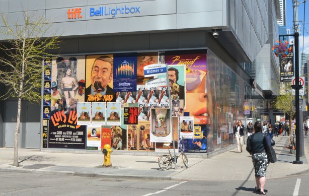 at the corner of King and another street, the TIFF Bell Lightbox building has an art installation on two sides, walls of fake movie posters. The installation is called 'Coming Attractions' and it is by a collective of artists known as The Long Weekend. 