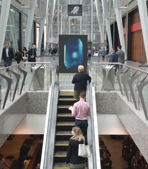 A picture taken inside the Allan Lambert Gallery at Brookfield Place, photos by Sjoerd Knibbeler, a series called Current Study large pictures standing in the middle of the gallery, as well as series called "Paper Planes" which are hung from the ceiling