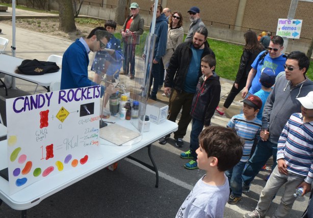 A student is doing a chemistry experiment to show how much energy is in gummi bear candy. He has lit one on fire and burned it to show the release of energy. It was done in a test tube. 