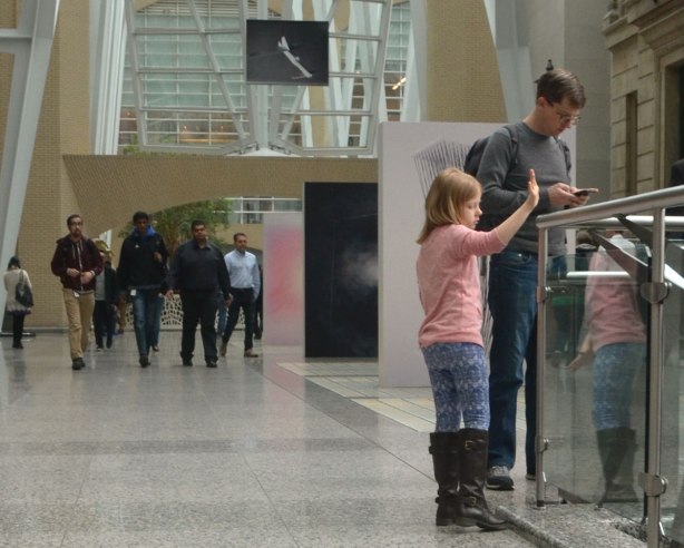 A picture taken inside the Allan Lambert Gallery at Brookfield Place, photos by Sjoerd Knibbeler, a series called Current Study large pictures standing in the middle of the gallery, as well as series called "Paper Planes" which are hung from the ceiling