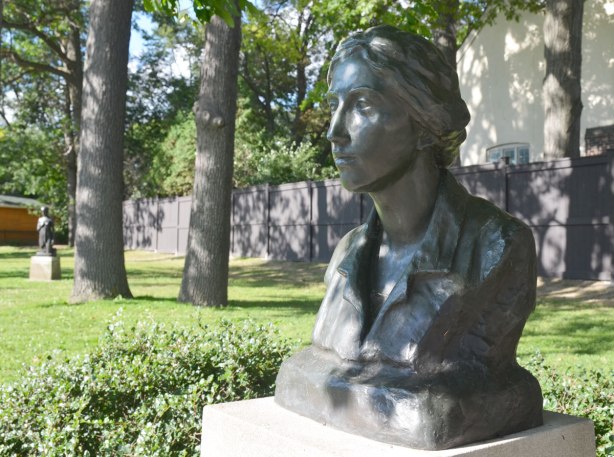 bust of Frances Loring, a Canadian sculptor, in a park, in the shade of a large tree 