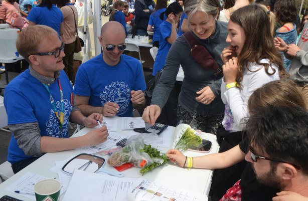 Two students are conducting a genetic phenotype test on a couple of volunteers. They are looking to see if they can smell fresias or taste coriander. 
