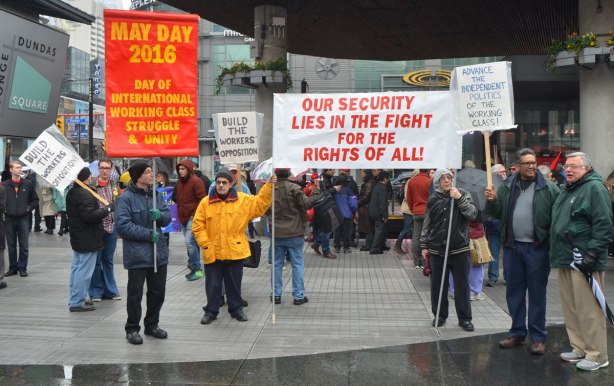 May day, International Workers Day rally at Dundas Square on a rainy day - 