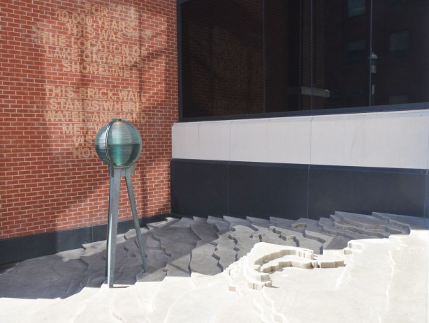 Shoreline Commemorative by Paul Raff, an art installation on Church St., south of King, that marks where the shoreline of Lake Ontario used to be. It involves words on a brick wall and a model of the shoreline of Toronto showing the different elevations of the land. 