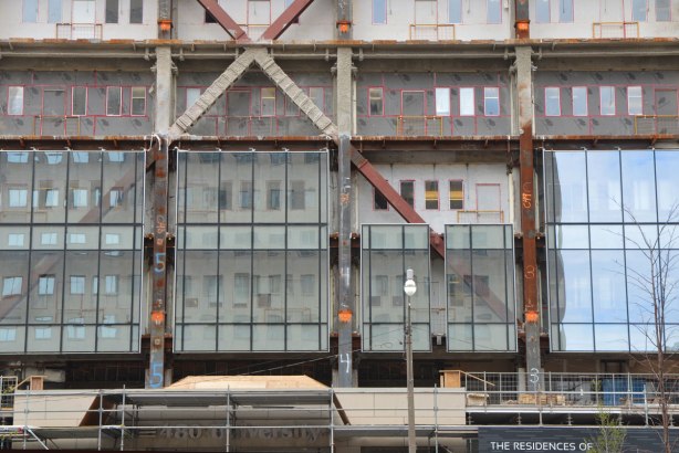 lower part of building have its facade upgraded to glass panels 