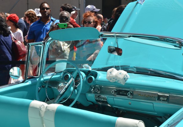 an old convertible car, Chevrolet Belair, with top down, turquoise car with matching white and turquoise interior 