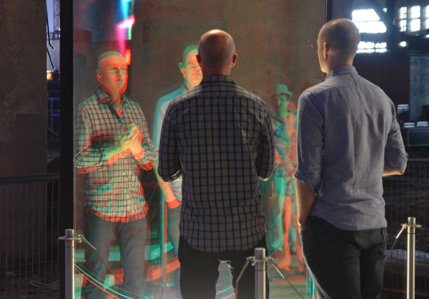 people interacting with an anaglyphic mirror at the 10th luminato festival, hearn generating station