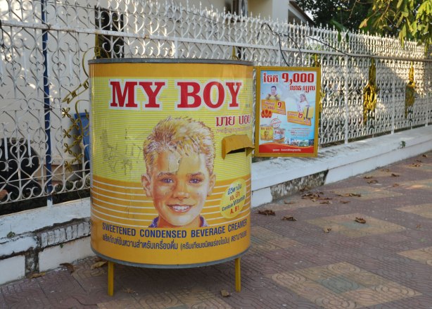 An ad for My Boy sweetened condensed milk. It is a large replica of the can, a white boy's face is on it. 