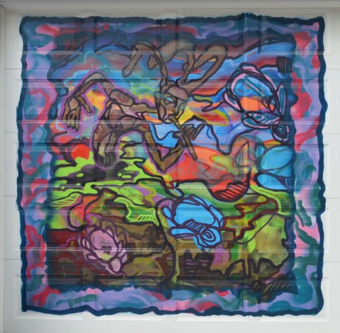 colourful mural on a laneway garage door