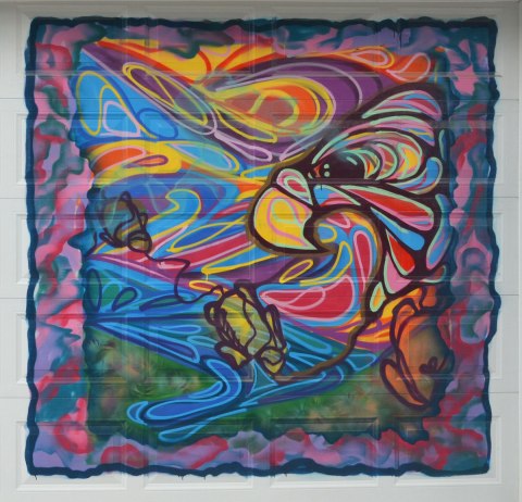 colourful mural on a laneway garage door