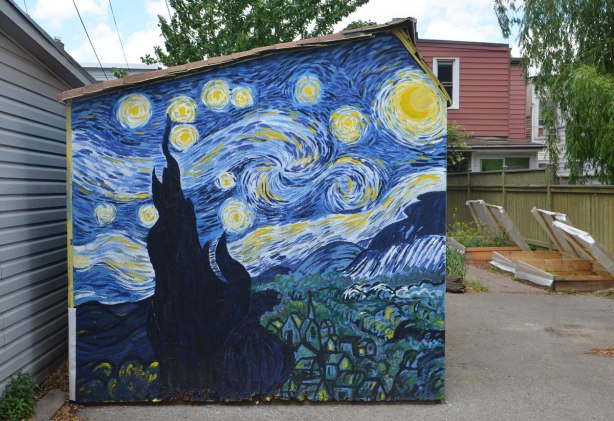 a copy of Vincent Van Gogh's 'Starry starry night' is painted on the side of a shed in a backyard. 