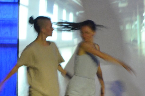 dancers performing in front a screen that's showing a video, night time, nuit rose performance 