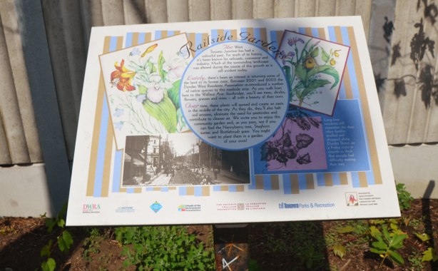 plaque describing the railside garden with words about its history and some picture of the plants that grow there 