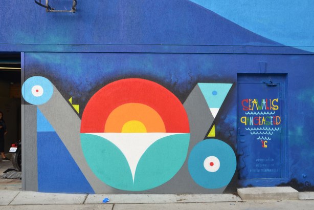 part of a mural by Peru, lots of blue, looks like a stylized snake 