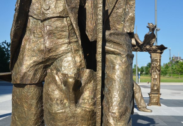 a face is upside down on a statue made from bits and pieces of other statues