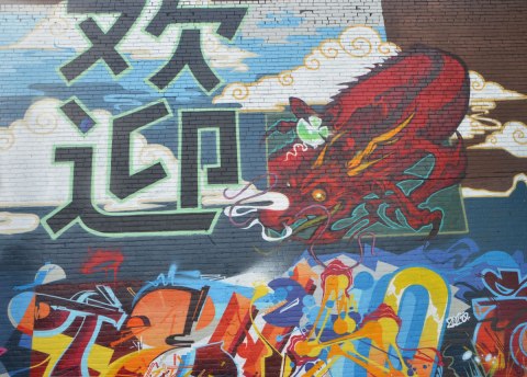part of a mural in Chinatown East, chinese characters and a red dragon