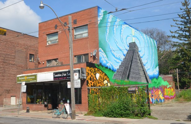mural on the side of building on Gerrard East, a picture of an ancient stone temple, Chichen Itza in Yucatan Mexico. 
