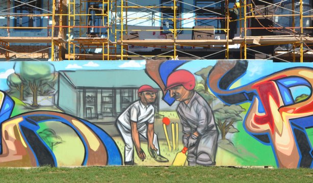 mural showing two male cricket players 