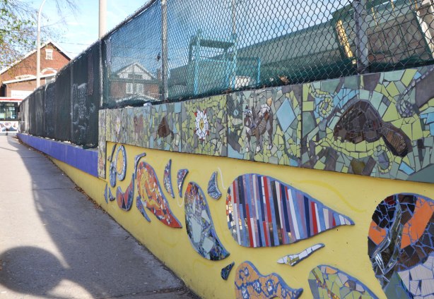 west side of the mural, yellow wall, Coxwell station, mosaic pictures