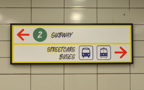 sign maker from Honest Eds store has redone some of the signs in Bathurst subway station plus, he has added some Honest Ed type promo signs around the station - the direction sign to subway and to exits. 