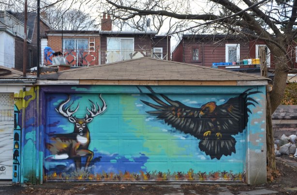 mural on a garage door, a deer and a hawk
