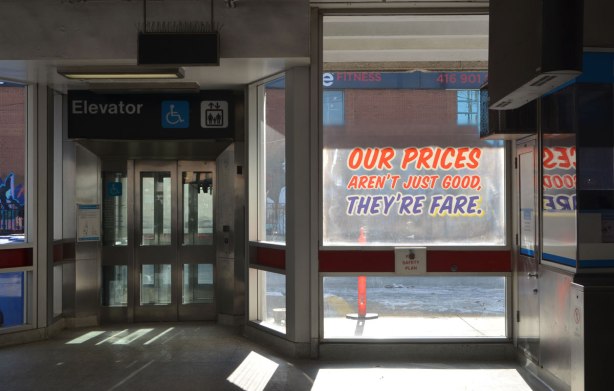 sign maker from Honest Eds store has redone some of the signs in Bathurst subway station plus, he has added some Honest Ed type promo signs around the station - on the window of the station, Our prices aren't always good but they're fare 