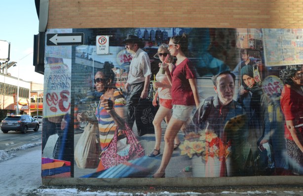 part of a mural in Honest Eds Alley by Matthew Monteith showing people walking past the windows of Honest Ed's store, large scale photo