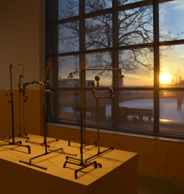 plumber assemblage, an artwork by Yto Barrada consisting of a few sculpture like pieces made from pipes, faucets, taps, shower heads and other plumbing things. 