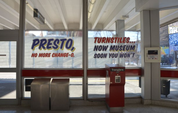 sign maker from Honest Eds store has redone some of the signs in Bathurst subway station plus, he has added some Honest Ed type promo signs around the station - on the window of the station are two signs, one says Presto no more change-o and the other says Turnstiles now museum soon you won't