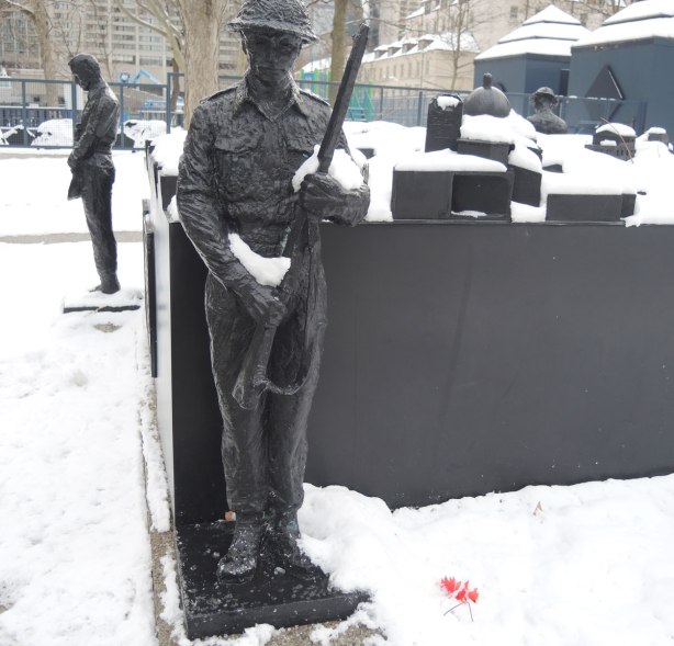 two soldiers stand vigil at the corners of a memorial, sculptures, 