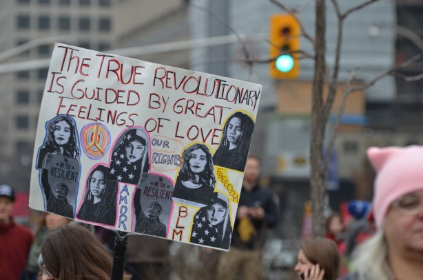 a sign at Womens March in Toronto that says The true revolutionary is guided by great feelings of love, 