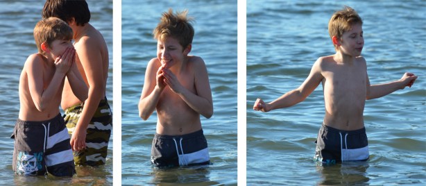 people participating in the 12th annual polar bear dip at Sunnyside Park in Toronto, in the icy cold water of Lake Ontario - a series of 3 shots as a boy gets into the water