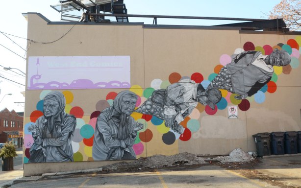 a mural by Troy Lovegates of people floating past, also lots of coloured circles 